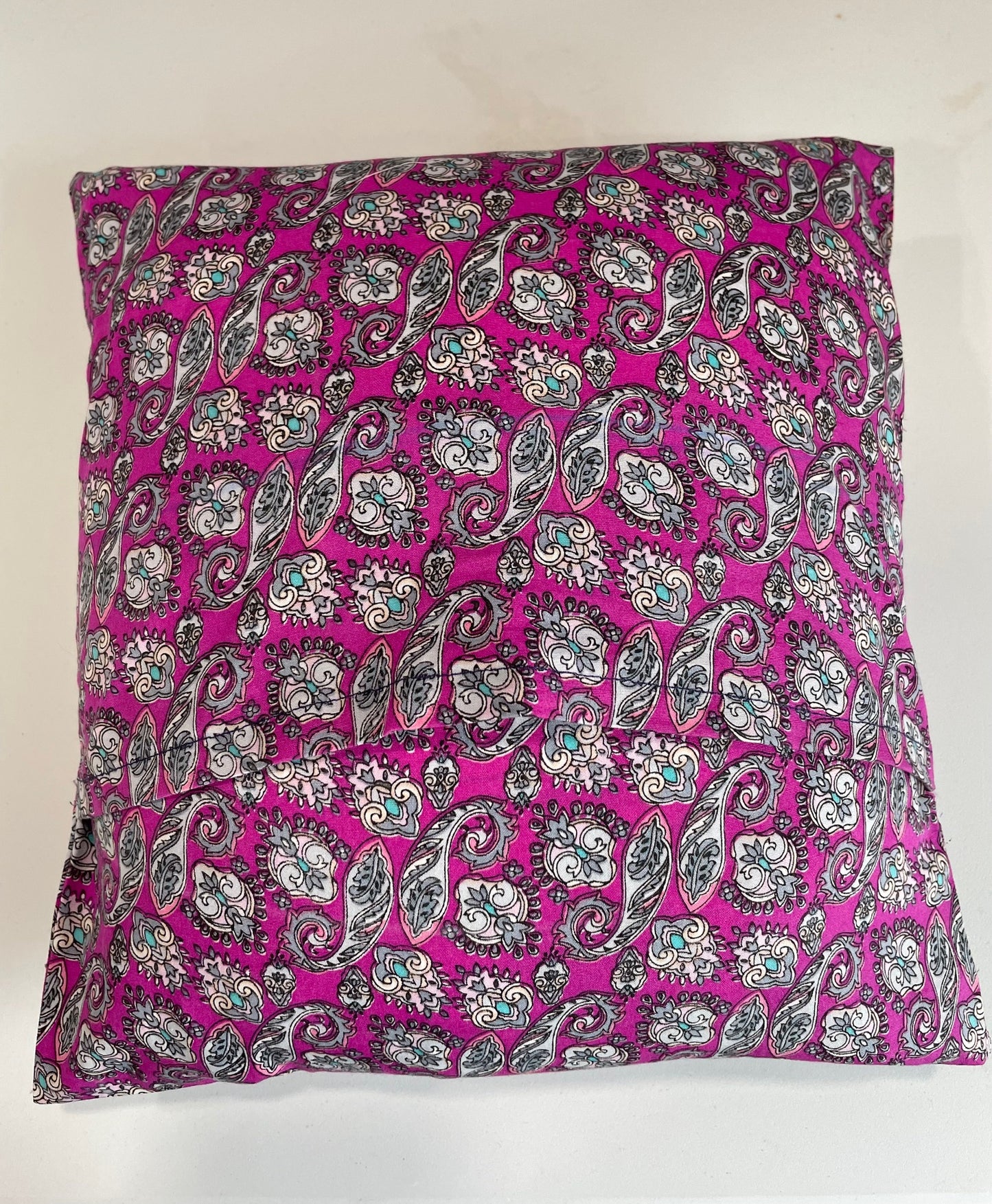 Decorative magenta paisley pillow