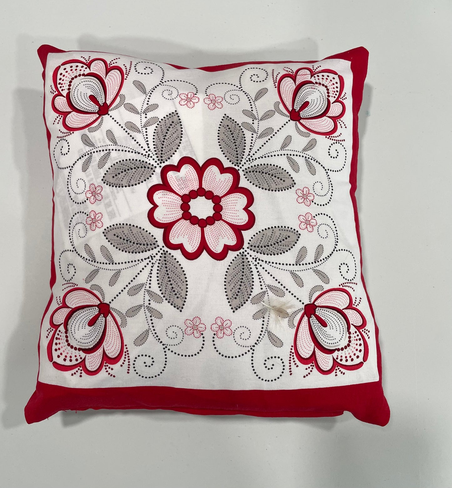 Red and white decorative pillow