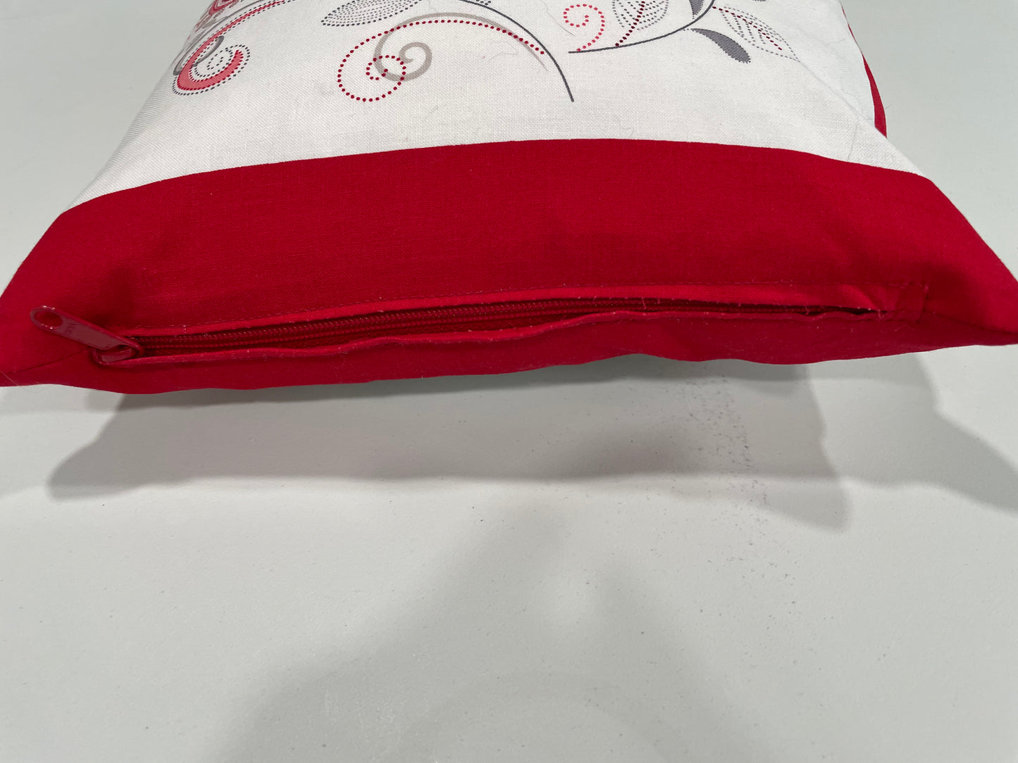 Red and white decorative pillow